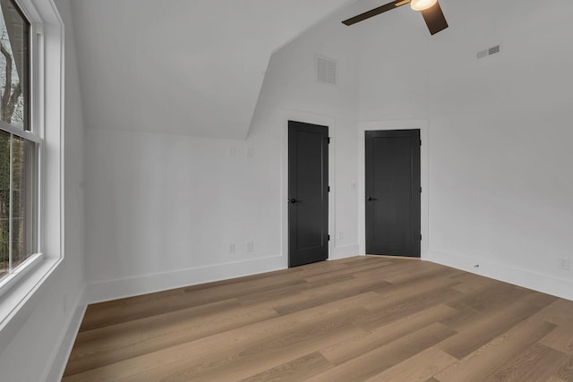 interior space with light hardwood / wood-style flooring, ceiling fan, and lofted ceiling