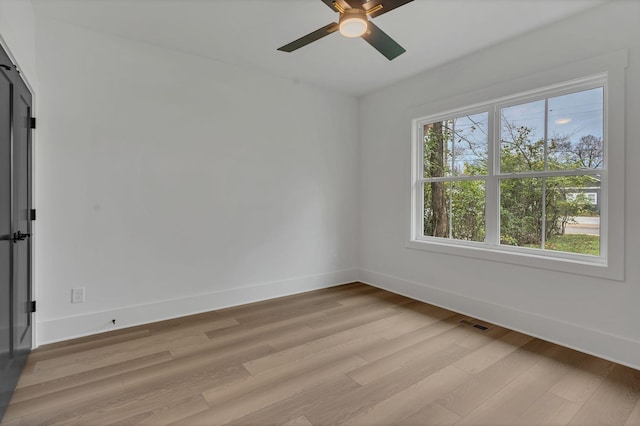 unfurnished room with ceiling fan and light hardwood / wood-style flooring