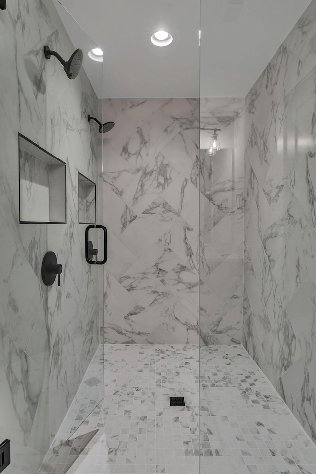 bathroom with a shower with shower door