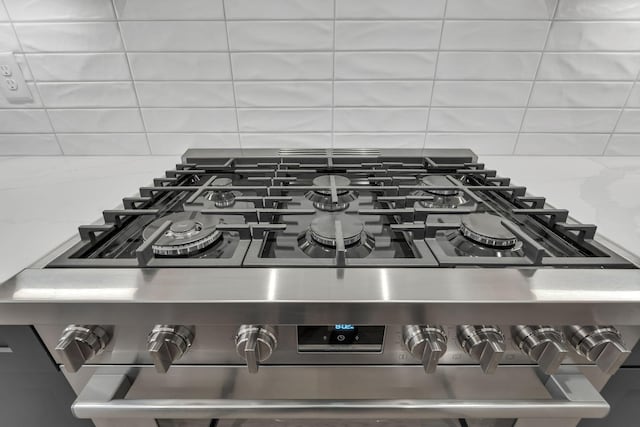 room details with decorative backsplash and stove