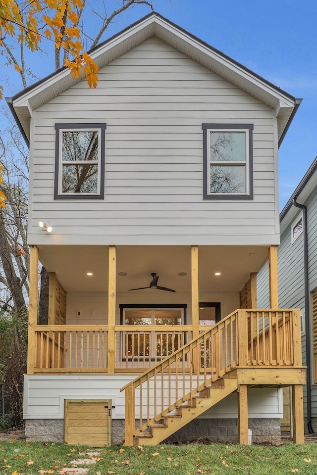 rear view of house featuring ceiling fan