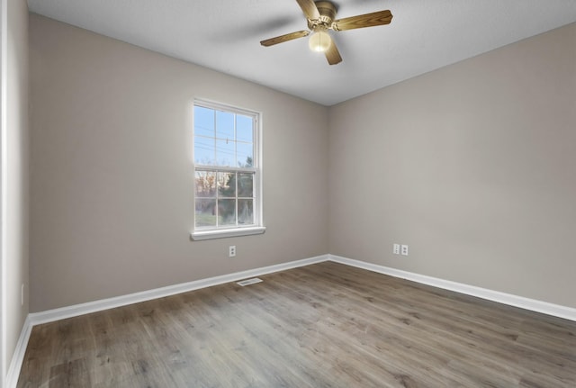 spare room with ceiling fan and hardwood / wood-style floors