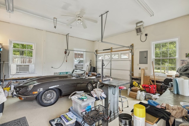 garage featuring cooling unit, electric panel, and ceiling fan