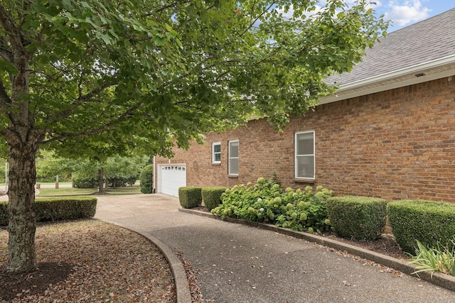 view of side of property with a garage