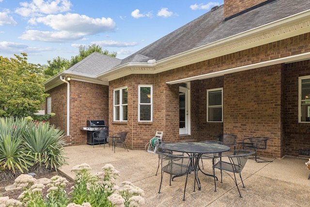 view of patio with a grill