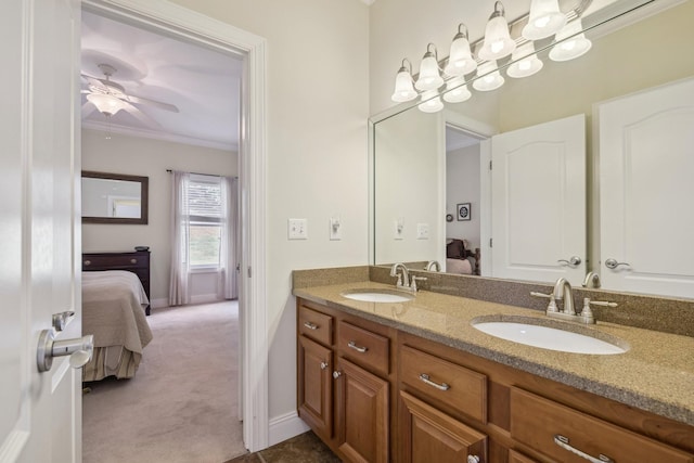 bathroom featuring vanity, ornamental molding, and ceiling fan