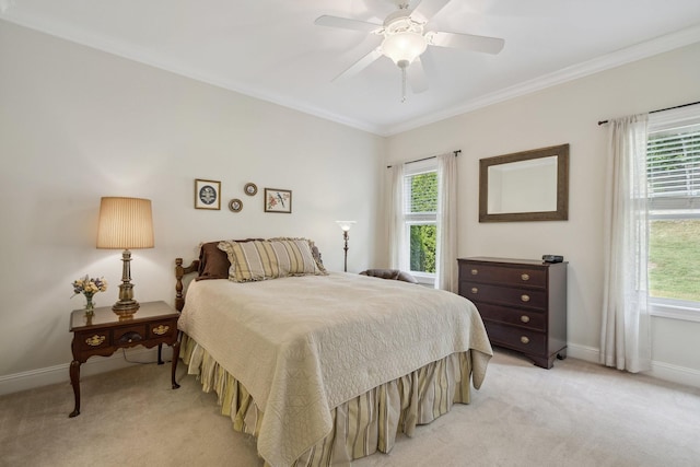 carpeted bedroom with crown molding and ceiling fan