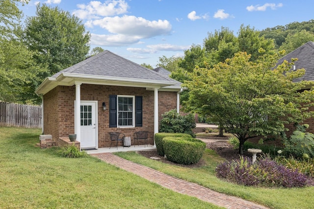 view of outbuilding with a yard