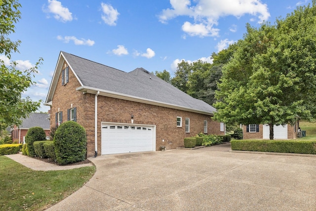 view of side of home featuring a garage