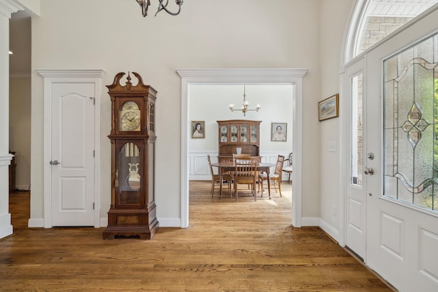 entrance foyer featuring a notable chandelier and hardwood / wood-style floors