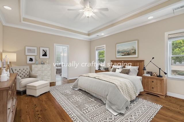 bedroom with multiple windows, wood-type flooring, and crown molding