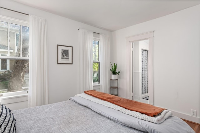 bedroom featuring wood-type flooring