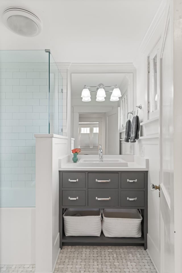 bathroom featuring vanity and crown molding