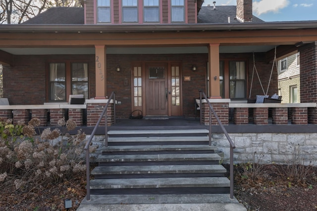 doorway to property with a porch