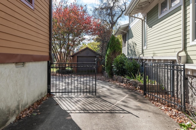 view of gate with an outdoor structure