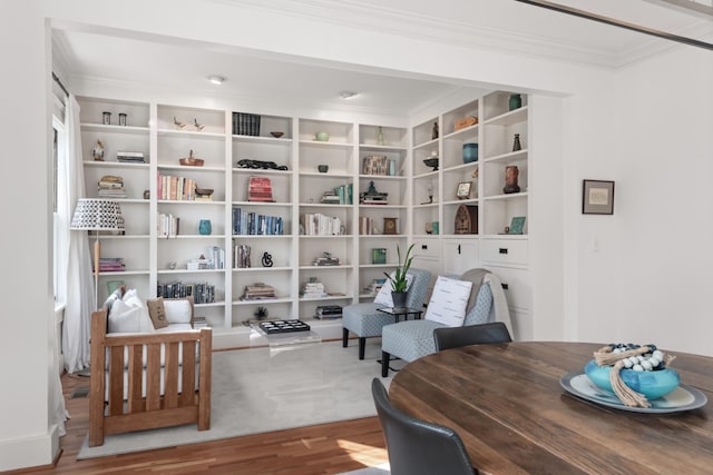 living area featuring hardwood / wood-style floors and built in features