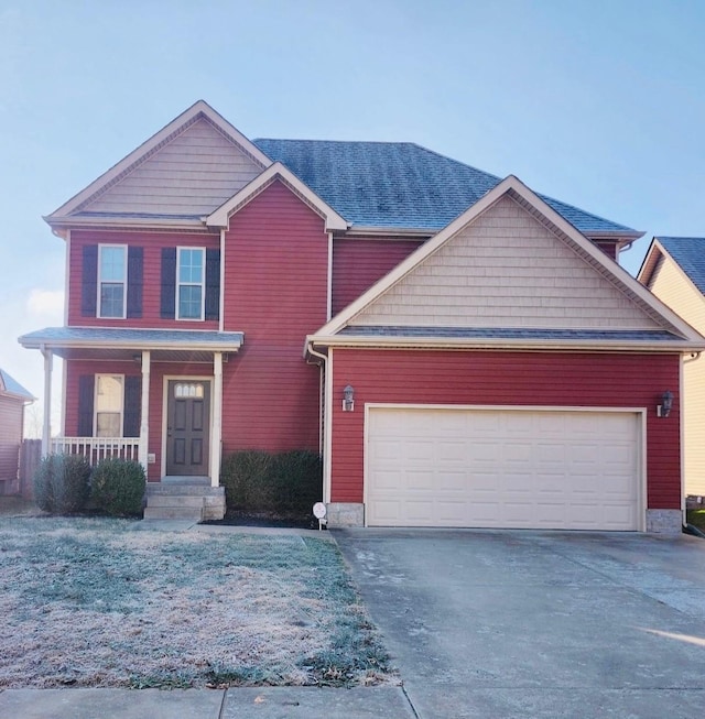 view of front of home with a porch and a garage