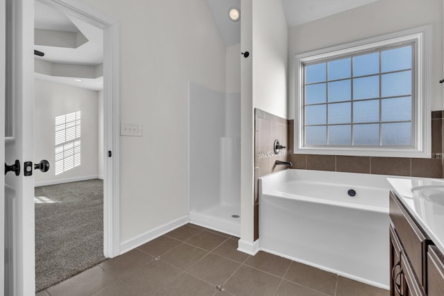 bathroom featuring separate shower and tub, vanity, and tile patterned floors