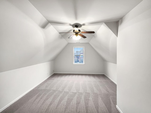 bonus room featuring ceiling fan, light colored carpet, and lofted ceiling