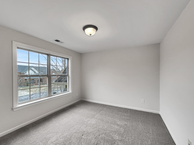 empty room featuring carpet flooring