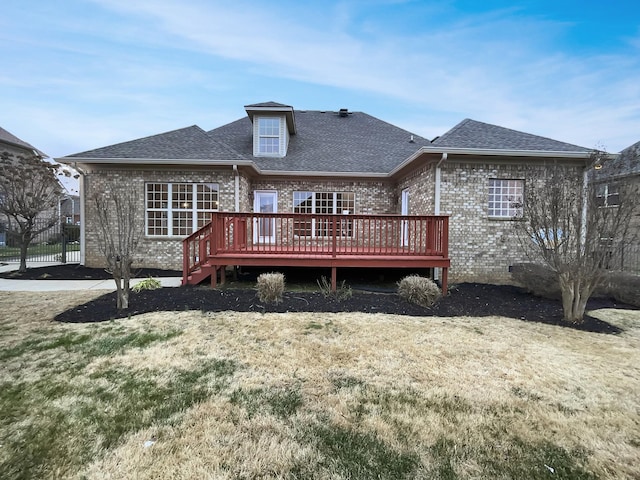 back of house with a yard and a wooden deck