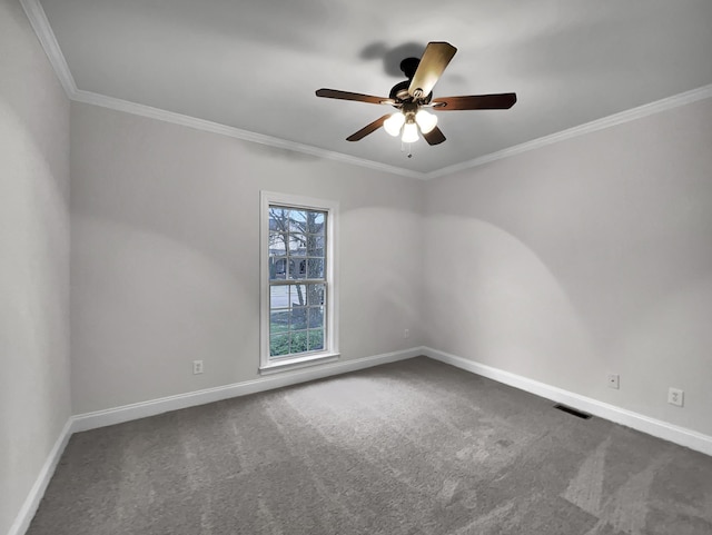 carpeted empty room featuring ceiling fan and ornamental molding