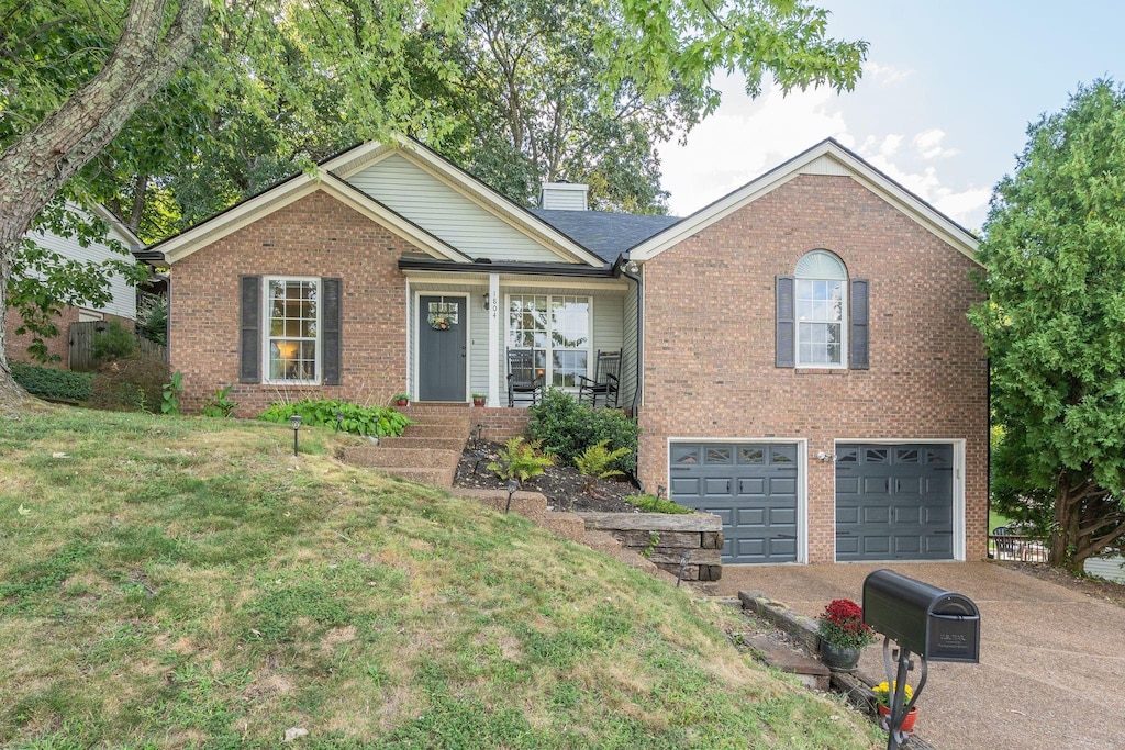 view of front of home featuring a garage and a front lawn