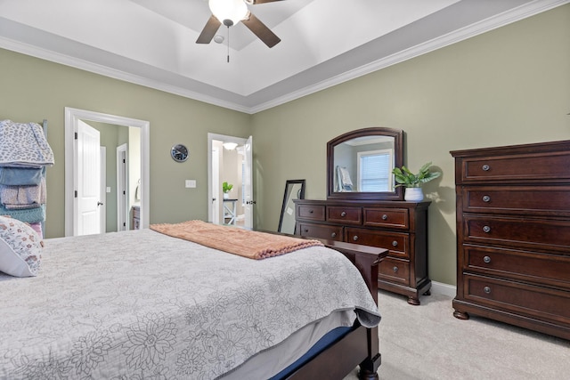 carpeted bedroom featuring ensuite bathroom, ceiling fan, and crown molding