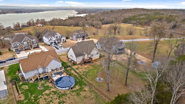 birds eye view of property featuring a water view