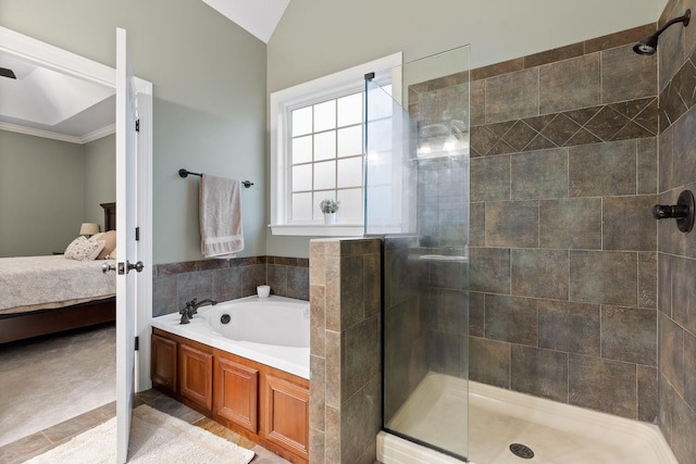 bathroom featuring independent shower and bath, lofted ceiling, and ornamental molding