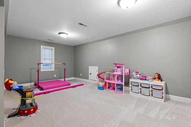 rec room with light carpet