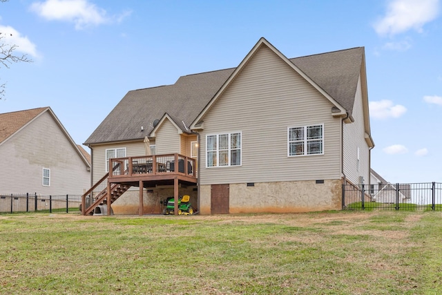 rear view of property featuring a lawn and a wooden deck