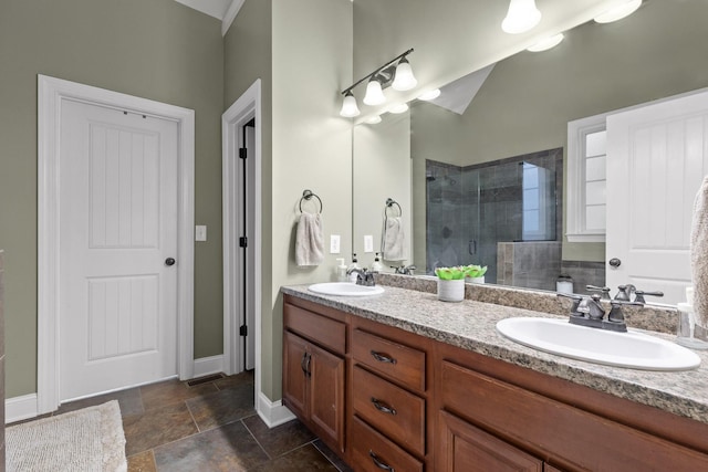 bathroom featuring vanity and a shower with shower door