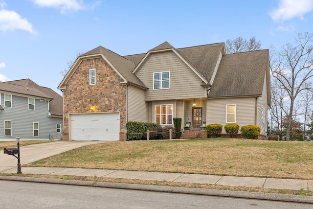 view of front of home with a garage and a front yard