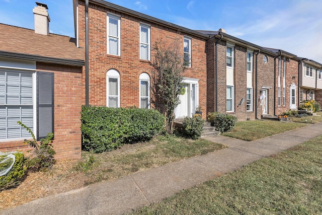 view of property with a front lawn