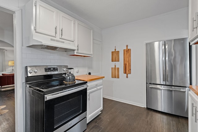 kitchen with crown molding, dark hardwood / wood-style flooring, backsplash, white cabinets, and stainless steel appliances