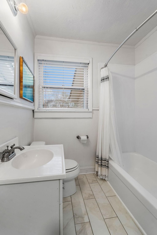 full bathroom featuring crown molding, shower / bath combo, a textured ceiling, and vanity