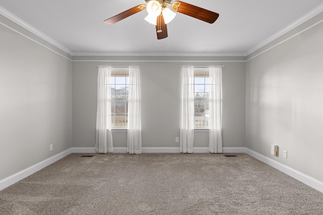 empty room with carpet, ceiling fan, and a wealth of natural light