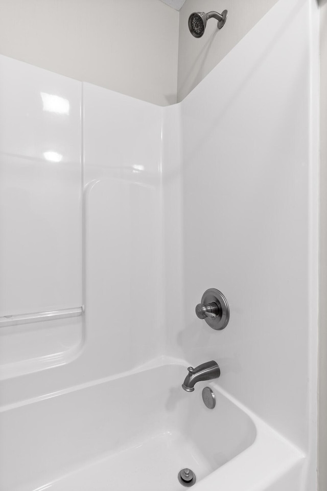 bathroom with washtub / shower combination