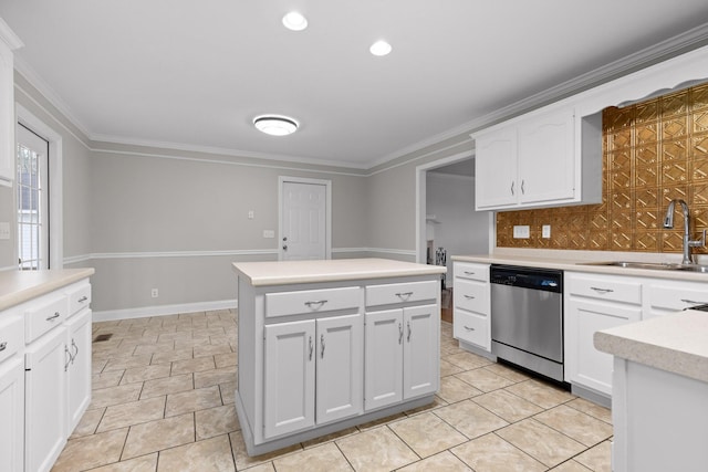 kitchen with sink, a kitchen island, stainless steel dishwasher, white cabinets, and ornamental molding