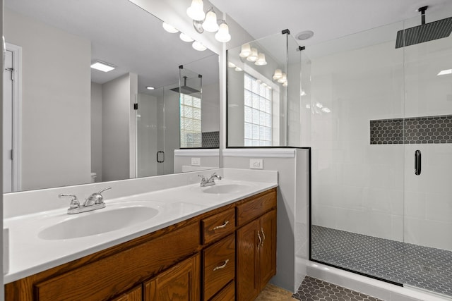 bathroom with vanity, tile patterned floors, and walk in shower