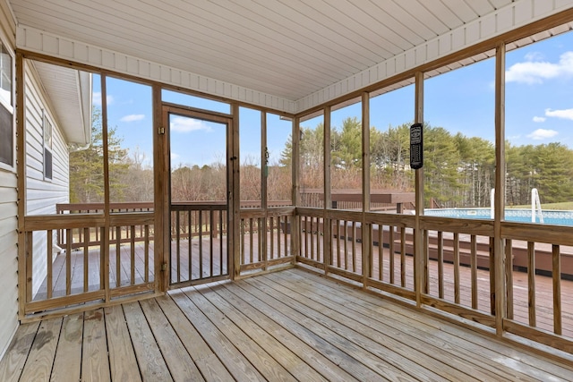 unfurnished sunroom with wooden ceiling