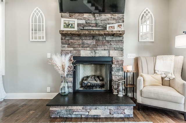 sitting room featuring hardwood / wood-style floors and a fireplace