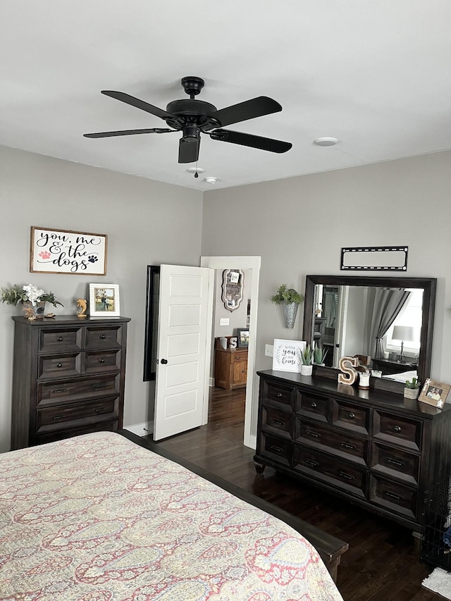 bedroom featuring ceiling fan and dark hardwood / wood-style flooring