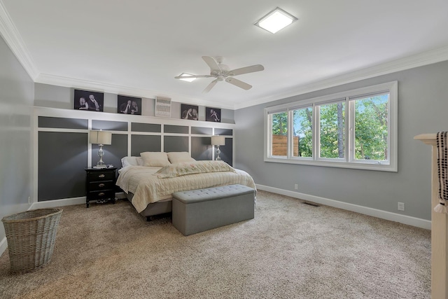 carpeted bedroom with ceiling fan and crown molding