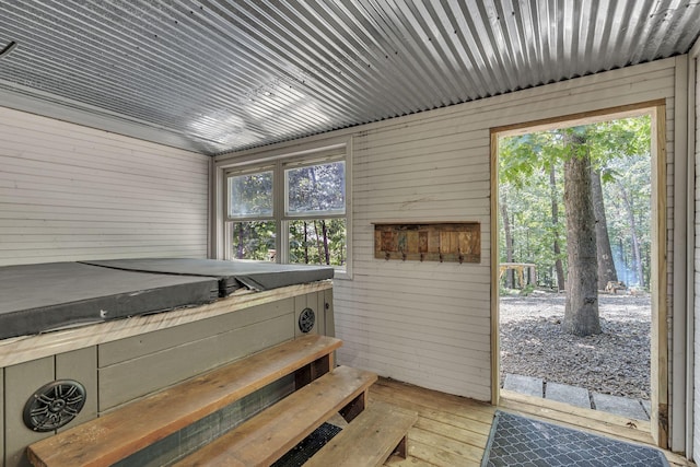 interior space with wooden walls and plenty of natural light