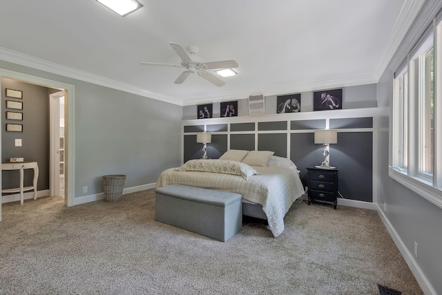 carpeted bedroom featuring ceiling fan and ornamental molding