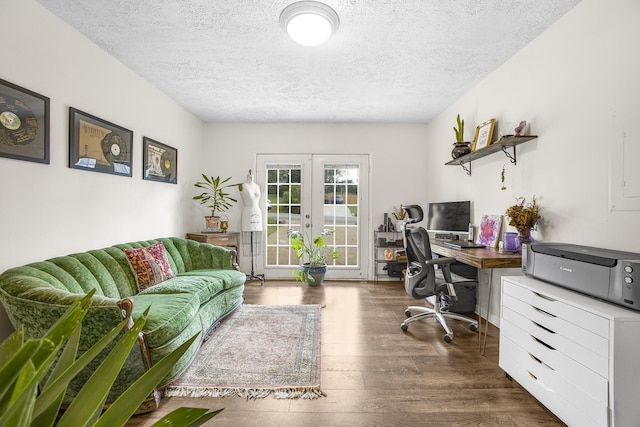 office with dark hardwood / wood-style flooring, a textured ceiling, and french doors