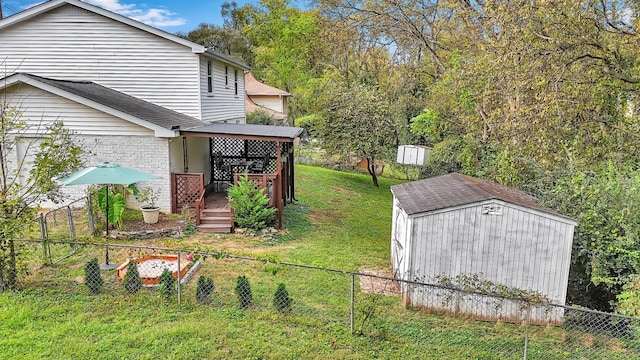 view of yard with a storage unit and a wooden deck