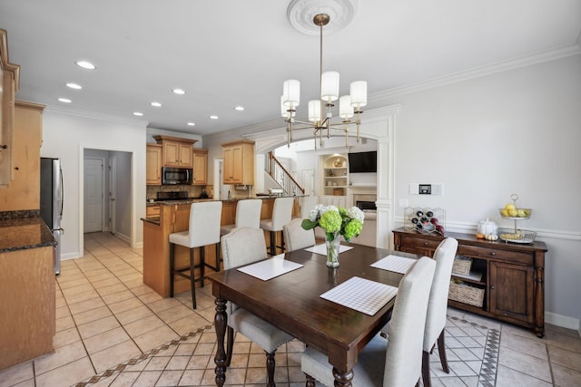 dining room featuring crown molding, light tile patterned floors, and a notable chandelier